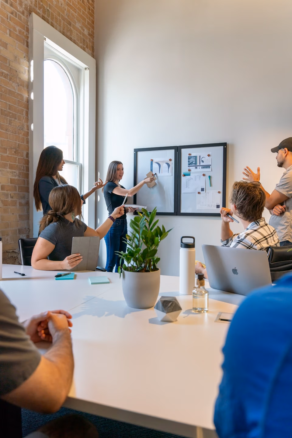 Diverse team collaborating around a conference table.